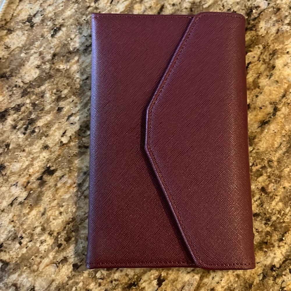 Plum colored wallet. Never used.  Listing # 490